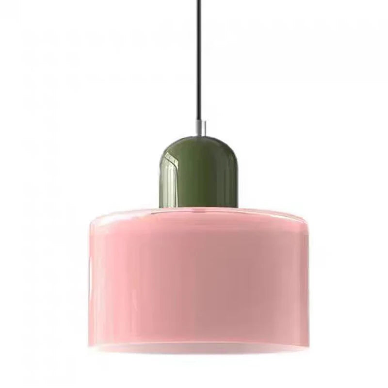 Pink Mira glass drum pendant with a green top on white