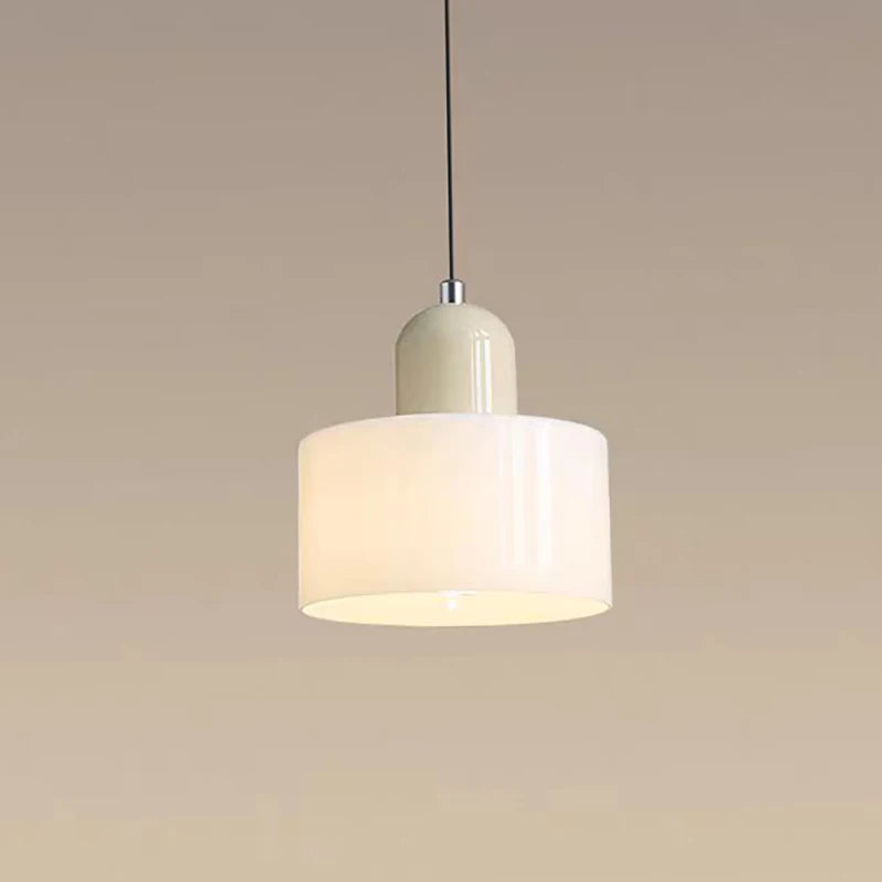 Illuminated beige Mira glass drum pendant with a pale top