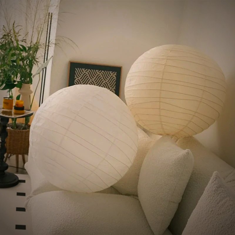 Kumo pendants in white paper above a sofa