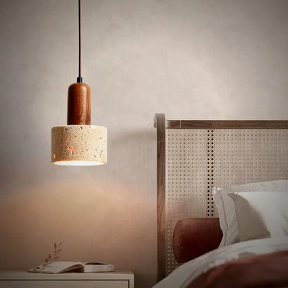 Sena travertine drum pendant beside a bed