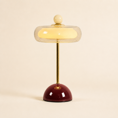Burgundy Oria rechargeable glass table lamp with a clear dome shade