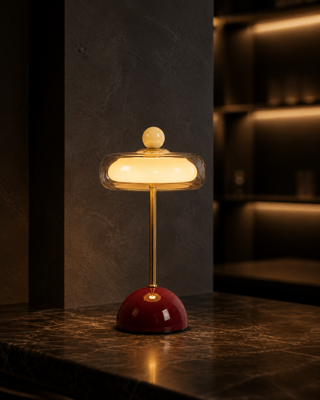 Burgundy Oria glass table lamp glowing on a restaurant table