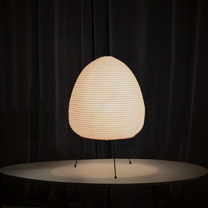 Ember Yumi paper lantern lamp glowing on a round table